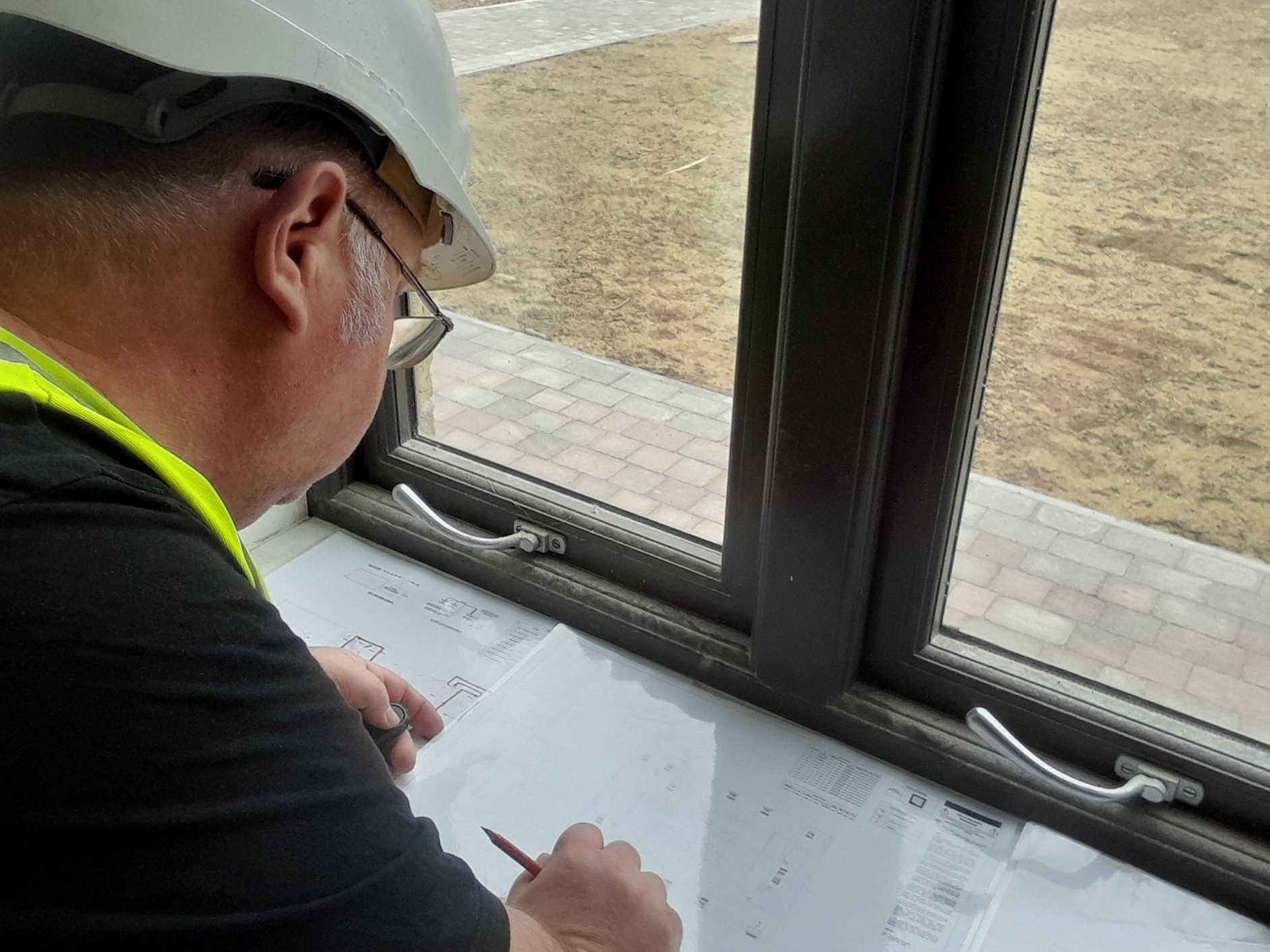 Gilly reviewing electrical plans